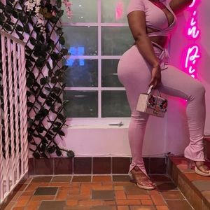 Pink two piece posh said,stretchy pants,stretchy wraparound shirt,soft baby pink